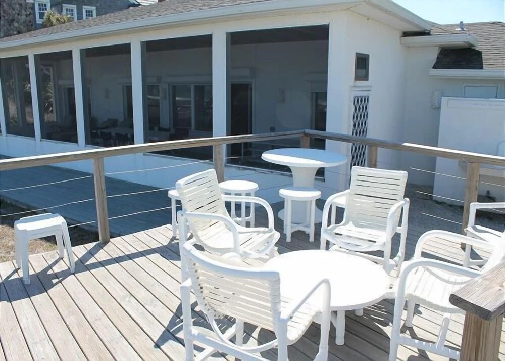 Ocean front Vacation Home with a large screened-in Patio by RedAwning