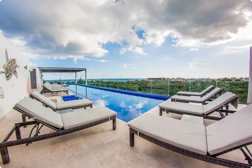 Magnificent 3BR condo close to the Caribbean sea by Happy Ad