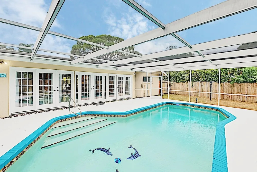 New Listing! Updated W/ Caged Pool & Patio 4 Bedroom Home