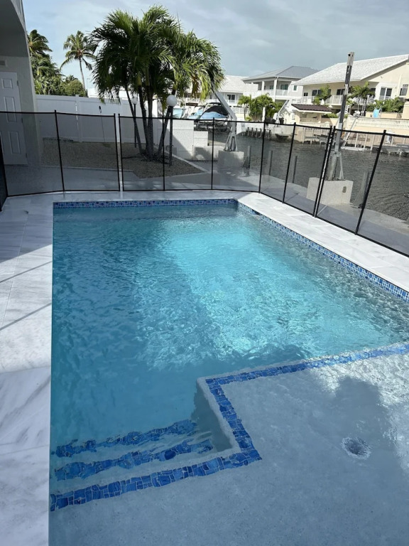 Beautiful Canal Front Home With Above Ground Pool, Dock And Fish Cleaning Station 4 Bedroom Home by RedAwning