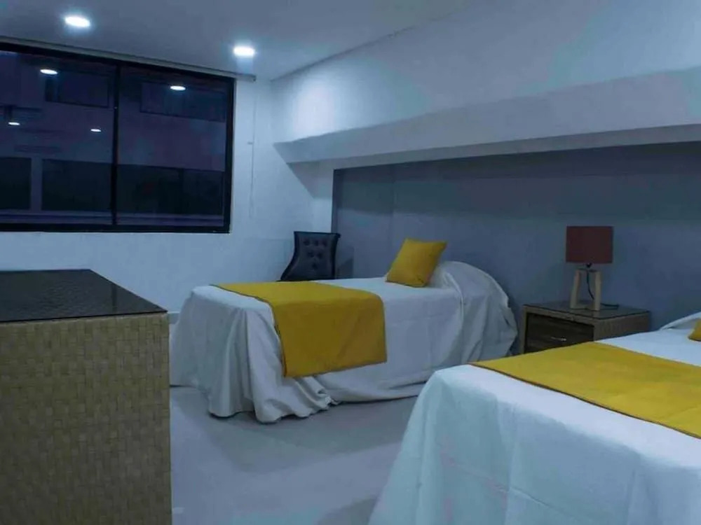 Malecon Rooms y Hotel