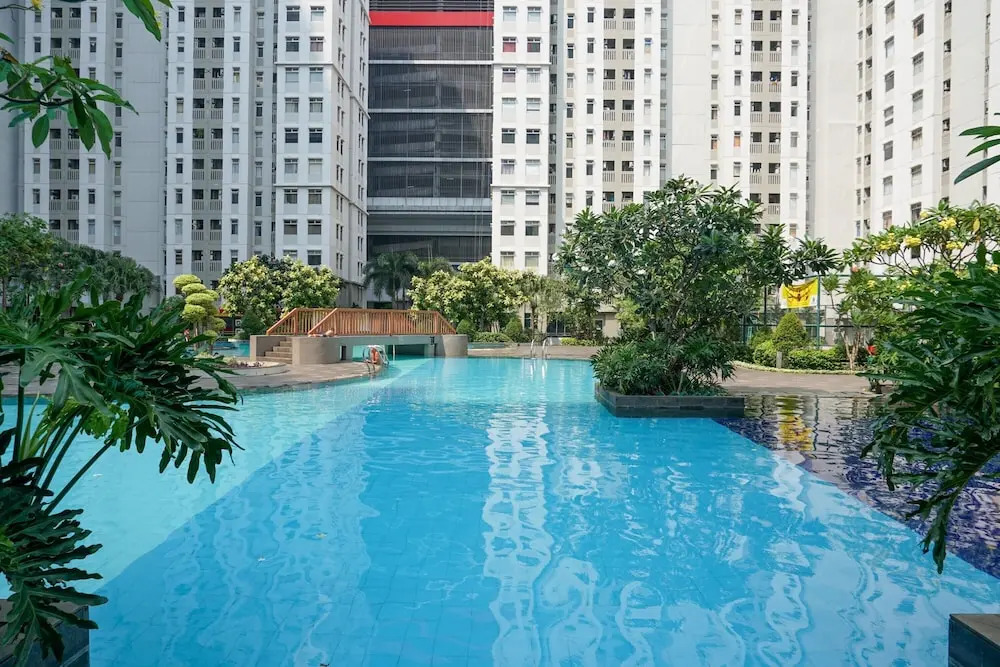 Beautiful 2BR with Direct Access to Pool Green Bay Pluit Apartment By Travelio