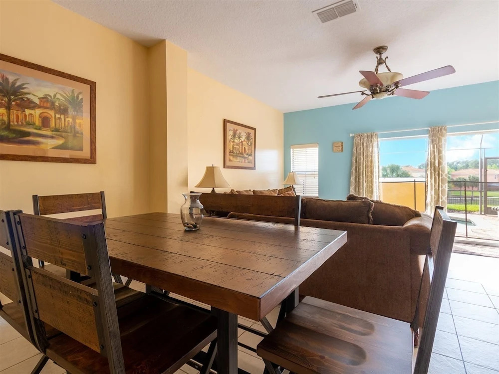 Private Screened Splash Pool Overlooking Tranquil Lake Right Beside Disney World by Florida Dream Homes