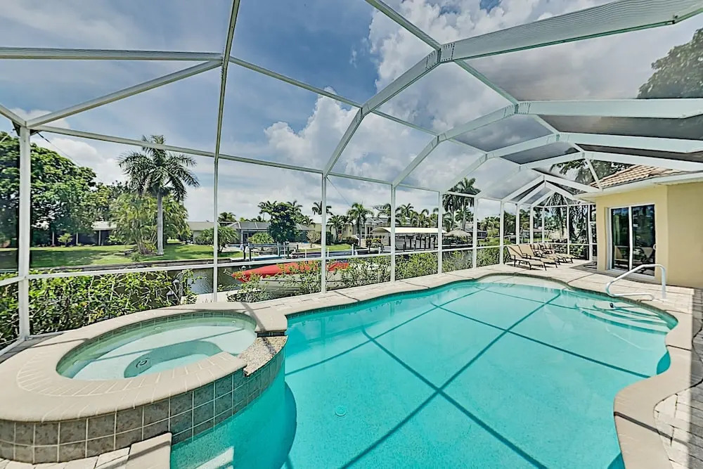 Upscale All-suite Canal W/ Dock & Fireplace 4 Bedroom Home