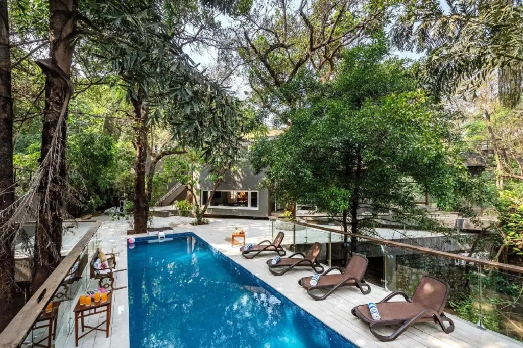 SaffronStays Odeon - 4BR heritage art deco villa with cantilever pool, verandahs & forested lawns