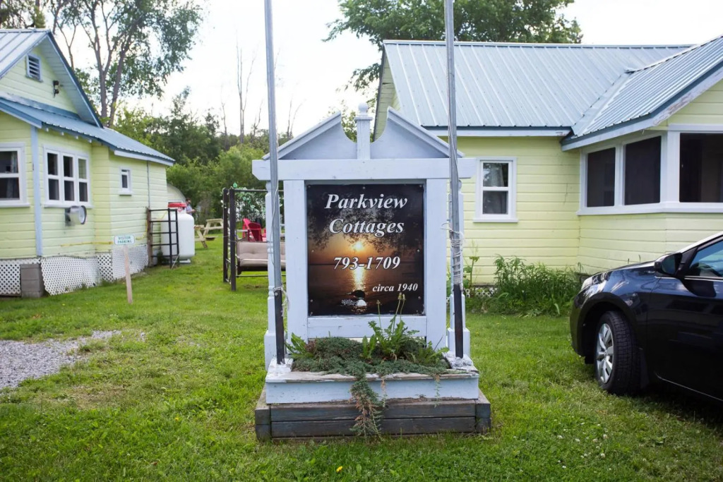 Family Relaxation Place for 2-15 People - 4 Lakeview Cottages with Real Sandy Swimming Beach, Dock, Boats, Firepits, Recreation Room