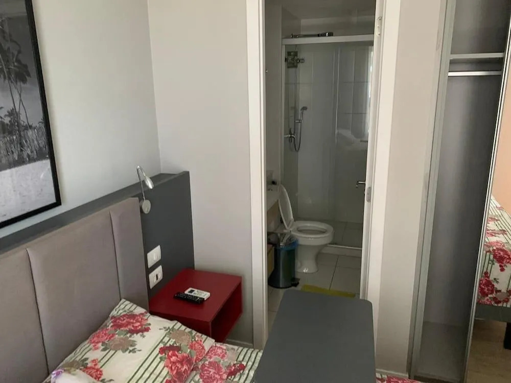 Quarto e Sala Particular em Aparthotel