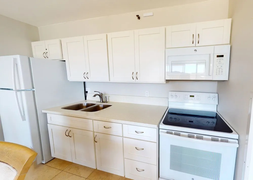 Waikiki Banyan High Level Condo with Ocean Views from the Private Lanai