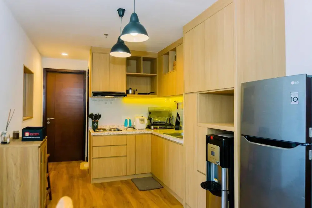 Spacious 1BR with Japandi Design at West Vista Apartment By Travelio