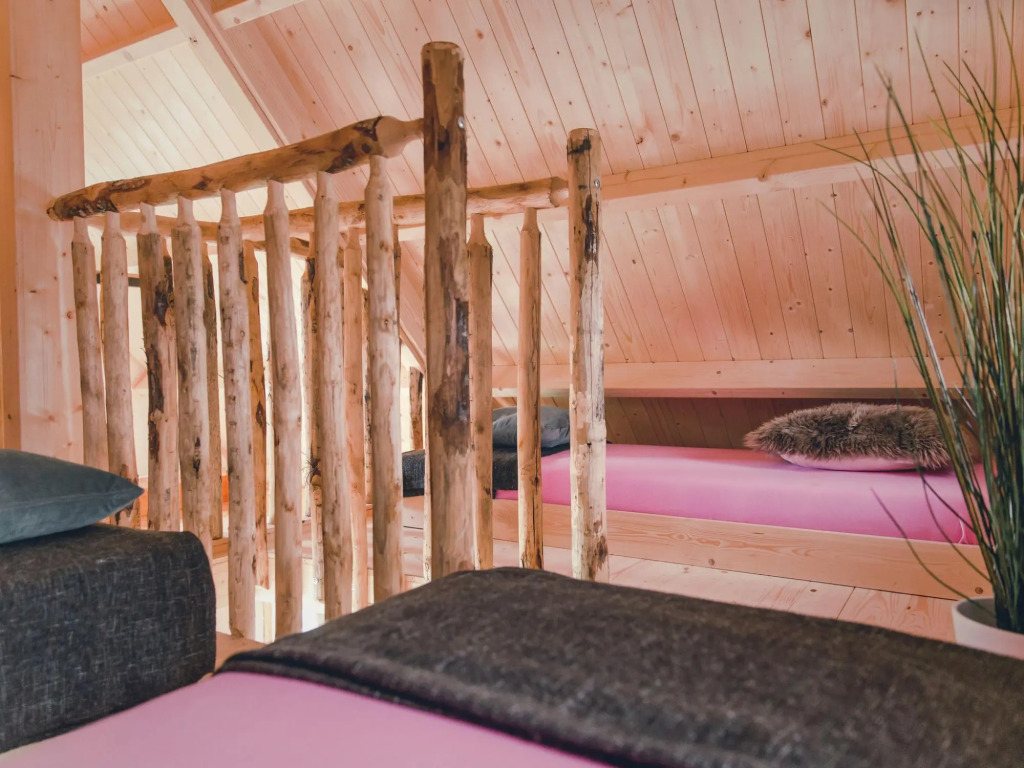 Beautiful wooden tree house with terrace in a holiday park on the river De Regge