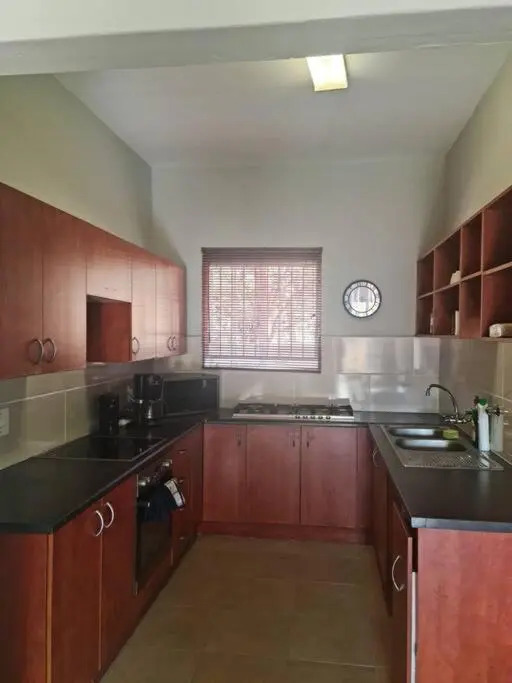 Justin's Place Lounge. An Exceptional Home with no Load Shedding, by The Grove Mall and Wilgers Hospital.