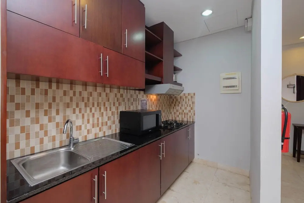 Luxury and Strategic 1BR Apartment at The Empyreal Epicentrum By Travelio