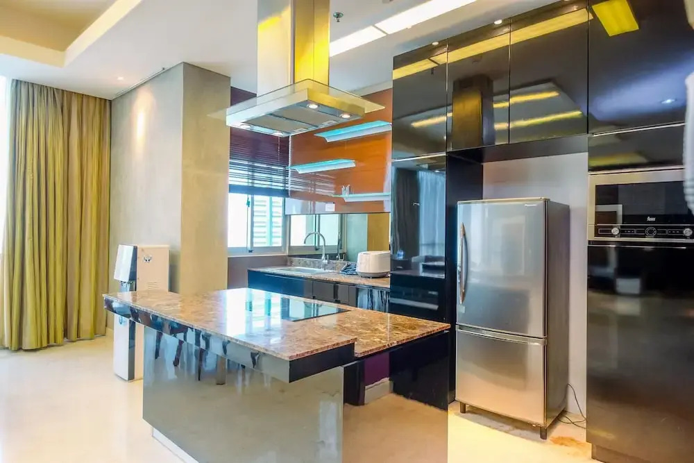 Homey Penthouse 3BR with Extra Room Kemang Village Apartment By Travelio