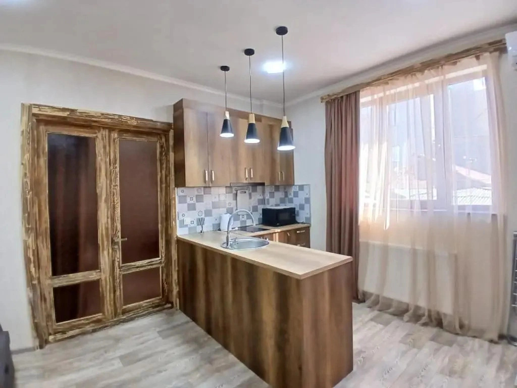 Апартаменты Two-bedroom family apartment for four guests with one large bed and two sofa beds