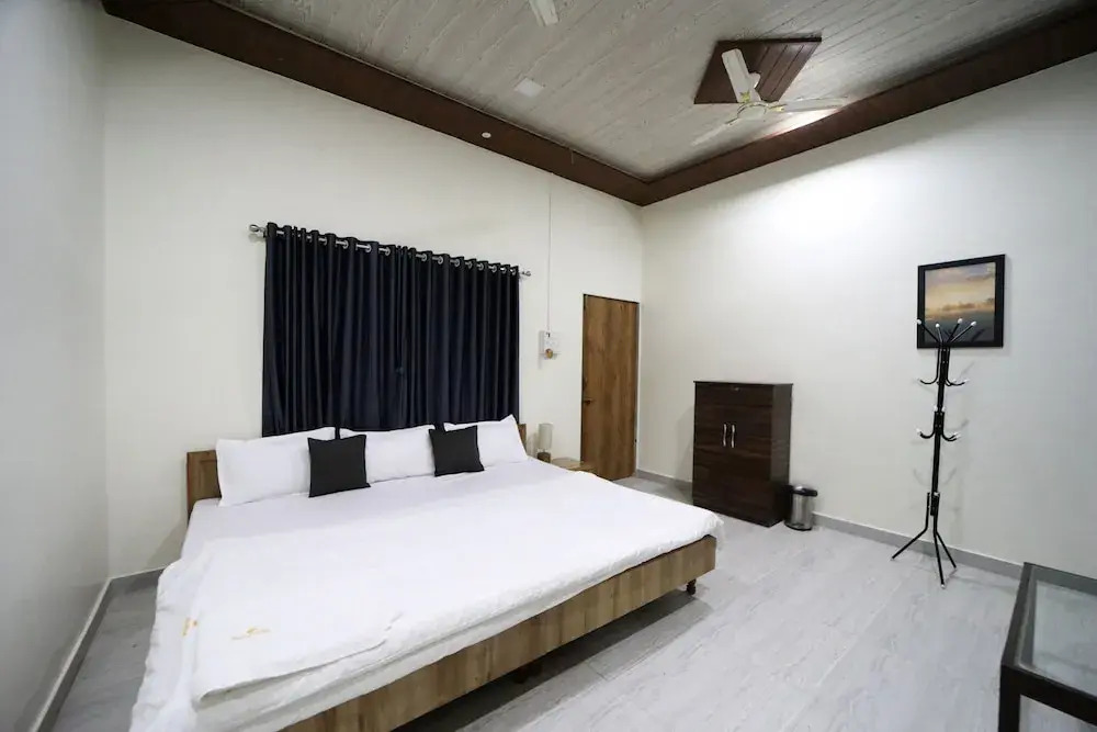 Whispering Palms by StayVista - Pool-view villa with Boutique interiors, Terrace & Lawn