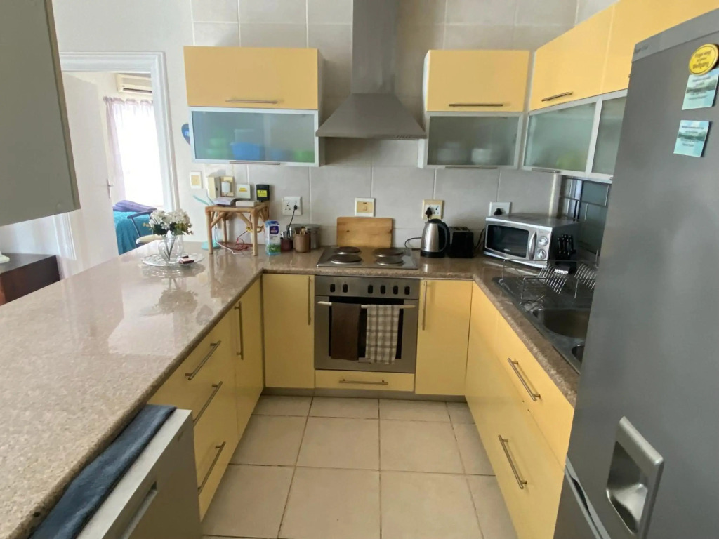 Cozy two bedroom unit in Strand with pool gym and laundromat