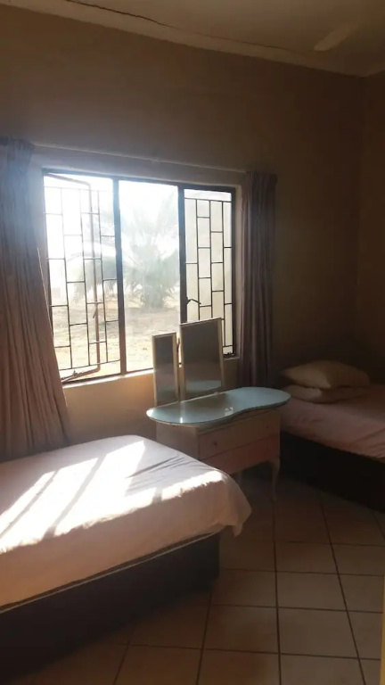 Comfy room with dstv and aircon in convenient location