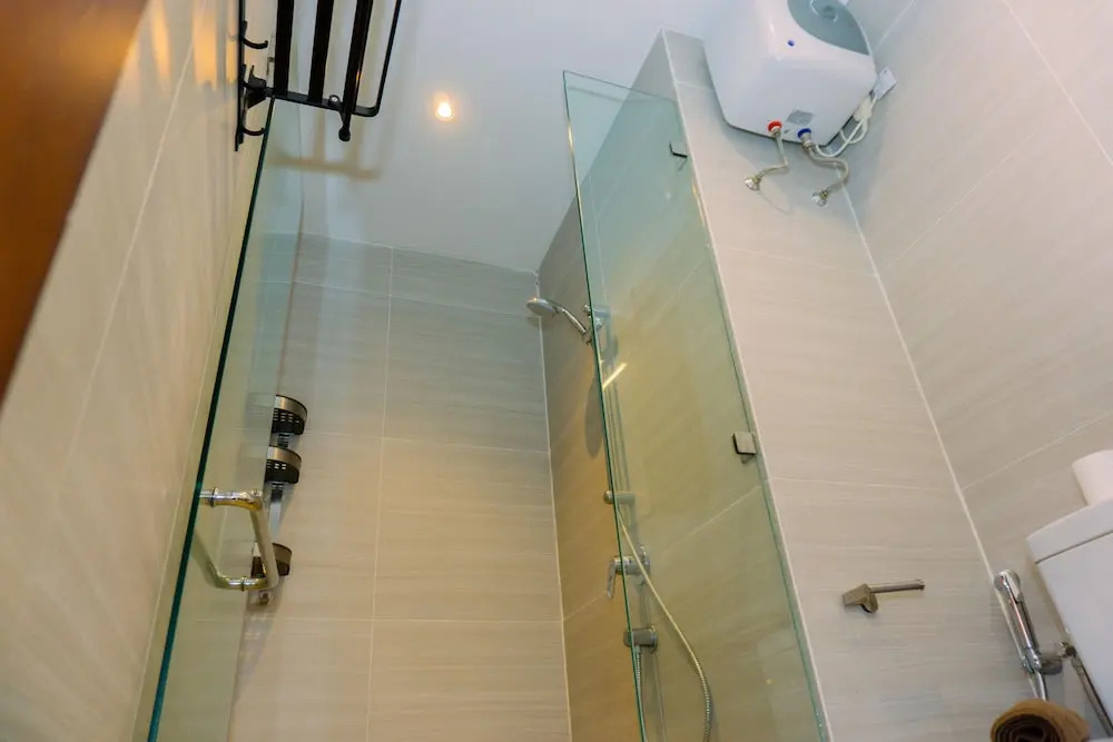 Spacious 1BR with Japandi Design at West Vista Apartment By Travelio