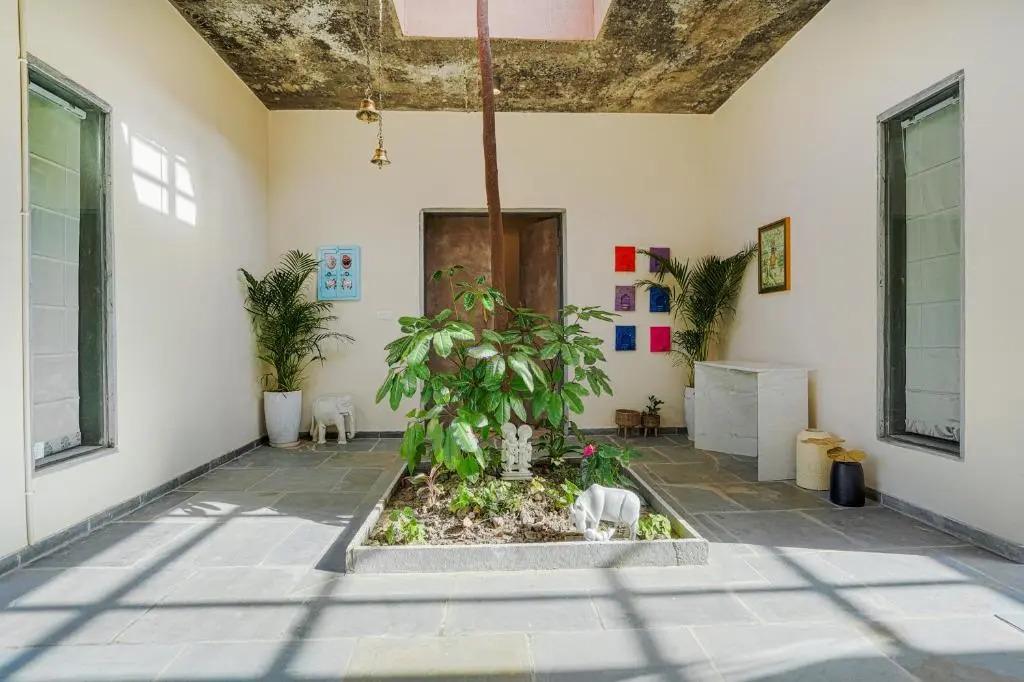 SaffronStays Moringa WishingTree - 3-BR villa near Nathdwara with pool, lawn and hillside views