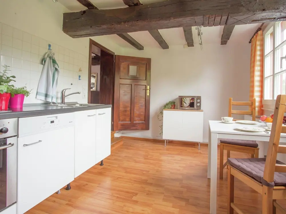 A Lovely Watermill Surrounded by Delightful Greenery