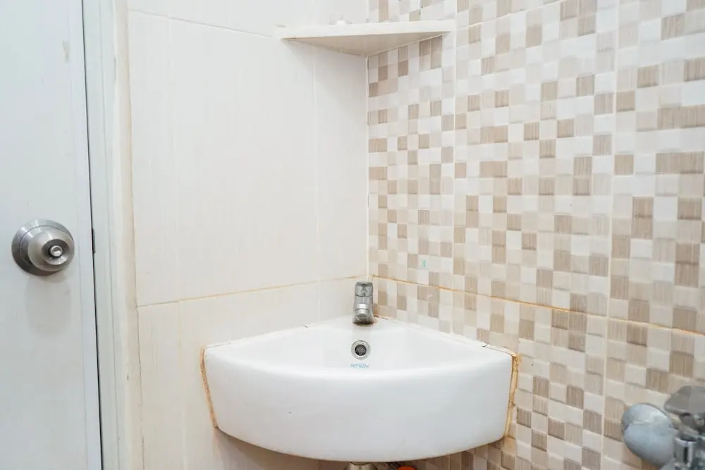 Homey 1BR with City View at Green Pramuka Apartment By Travelio