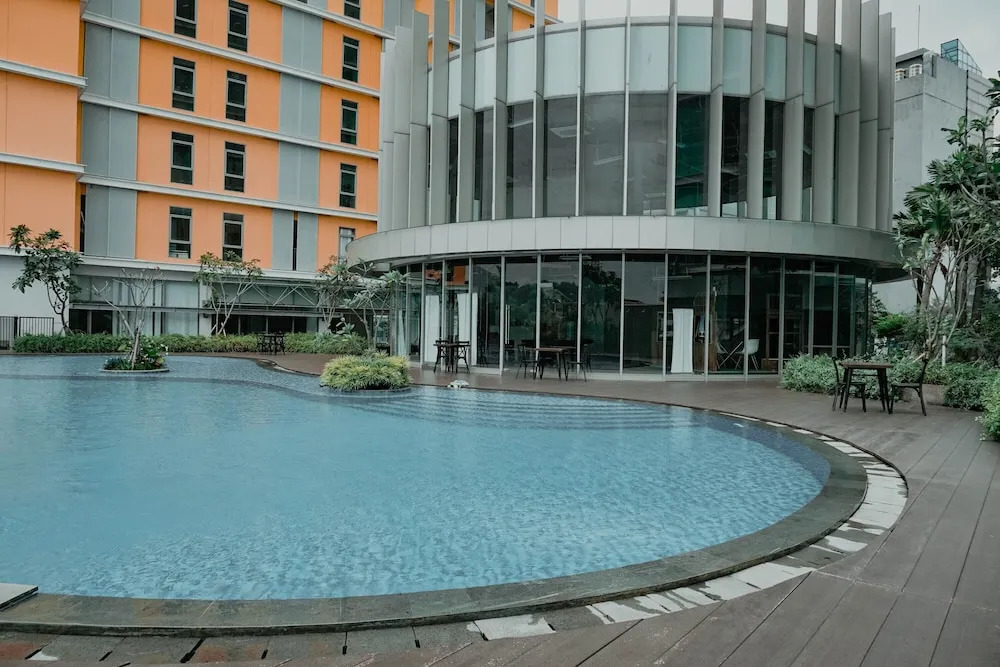 Homey and Fully Furnished 1BR Apartment at Pejaten Park Residence By Travelio