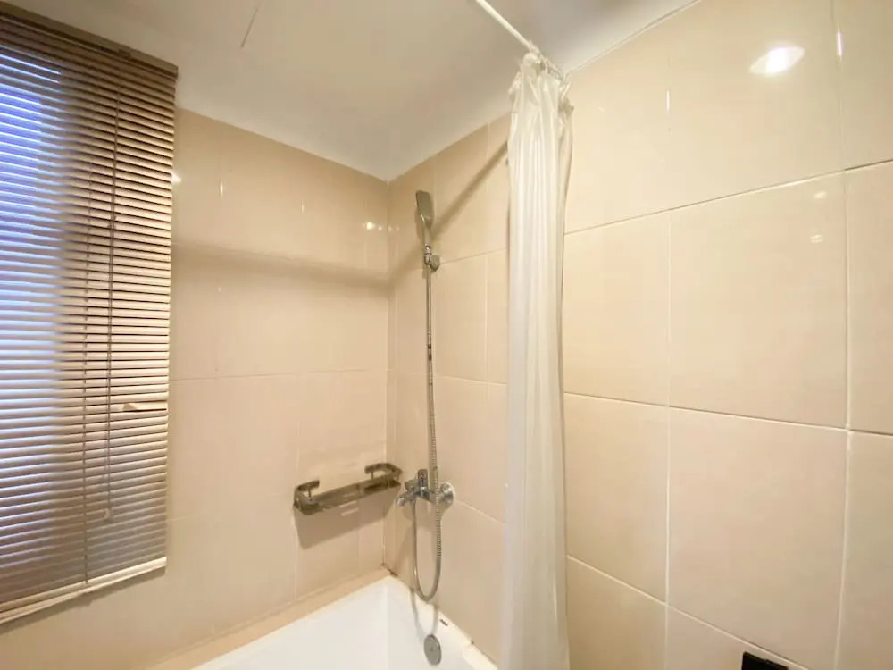 Cozy and Minimalist 2BR at 8th Floor The Oasis Cikarang Apartment By Travelio