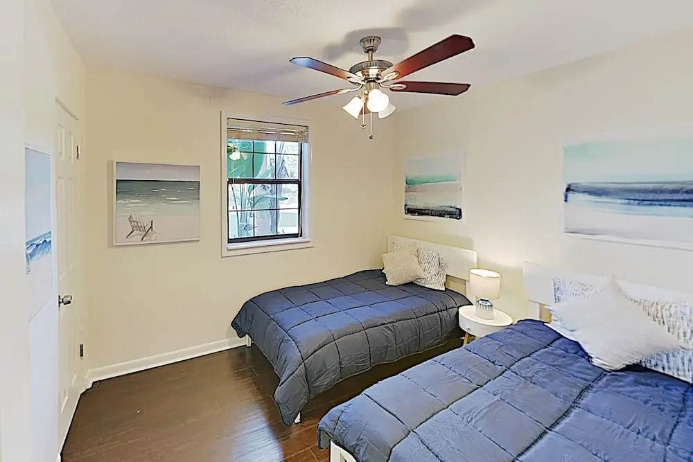 Updated W/ Gated Pool & Screened-in Porch 4 Bedroom Home