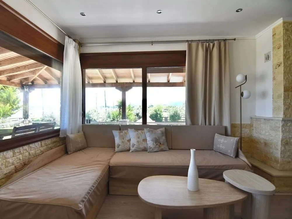 Spacious Beachfront Retreat With Large Garden in Ormos Panagias