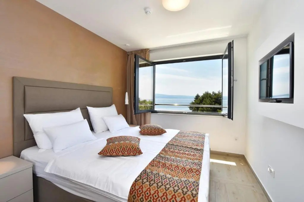 Luxury, seafront Villa Petra with heated pool only 50m from beach