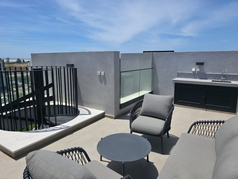 Rooftop Sunset Garden by Staycom