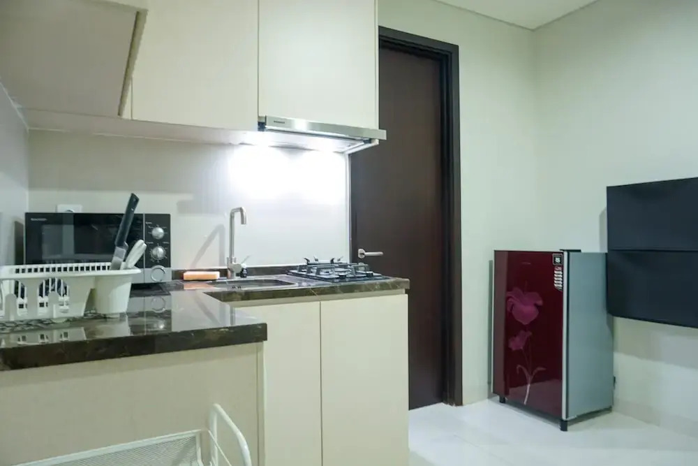 Strategic Location 1BR Apartment @ Puri Mansion near Puri By Travelio