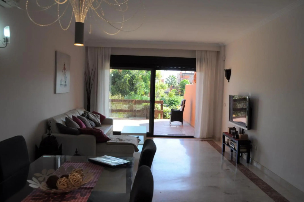 Precioso apartamento con jardín y piscina comunitaria