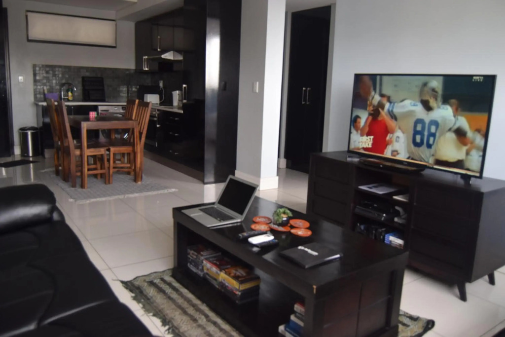 Highrise Windhoek apartment with skyline view, pool and gym