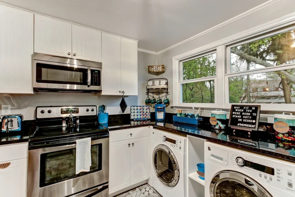 Vibrant, Colorful Condo Building With Backyard Firepit and Games