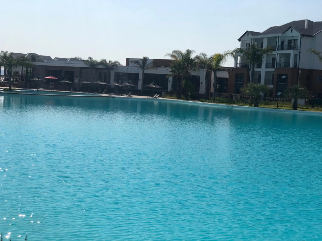 A Coastal/island experience at a Large 2 bed apartment at a Crystal Lagoon Estate