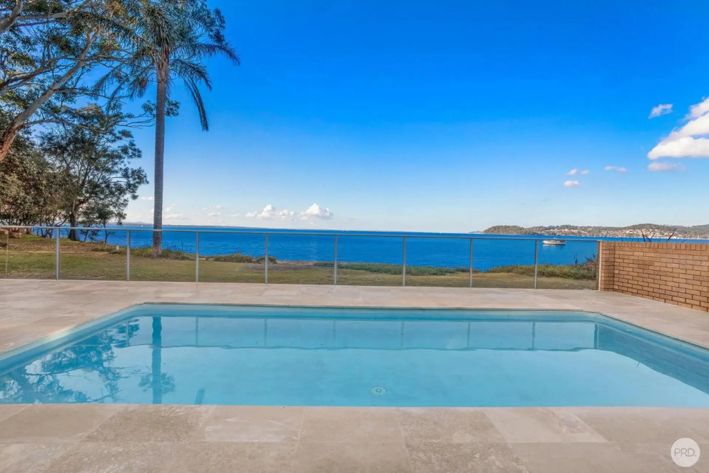 Seaside Sanctuary - Waterfront Luxury Home with Heated Pool
