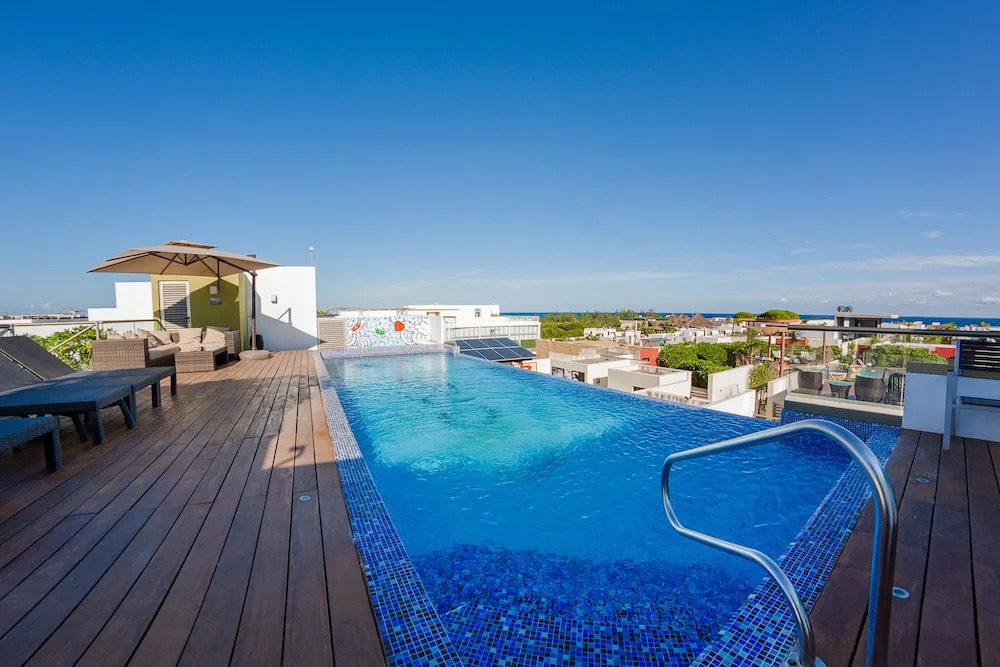 Fun and Relaxing  2BR PH steps away from the beach by Happy Address