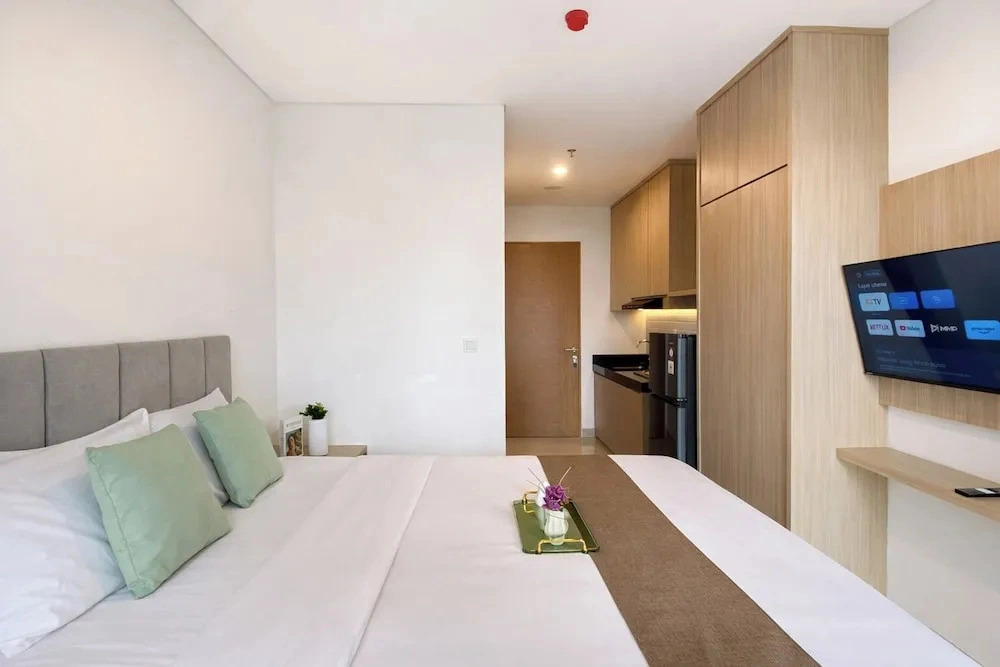 Homey Wooden Touch Studio At Apartment Ciputra World 2
