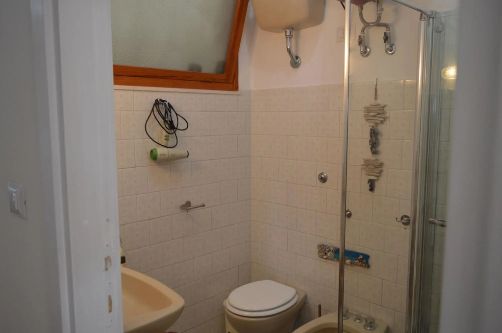 Holiday home on the Torregrande seafront, 30 meters from the seashore-Casa delle Palme