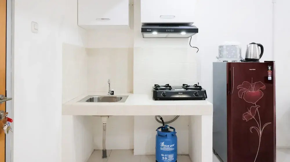Homey 2BR at Puncak Permai Apartment By Travelio