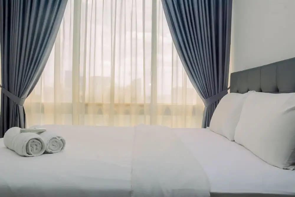 Comfy and Spacious 2BR The Masterpiece Epicentrum Apartment By Travelio