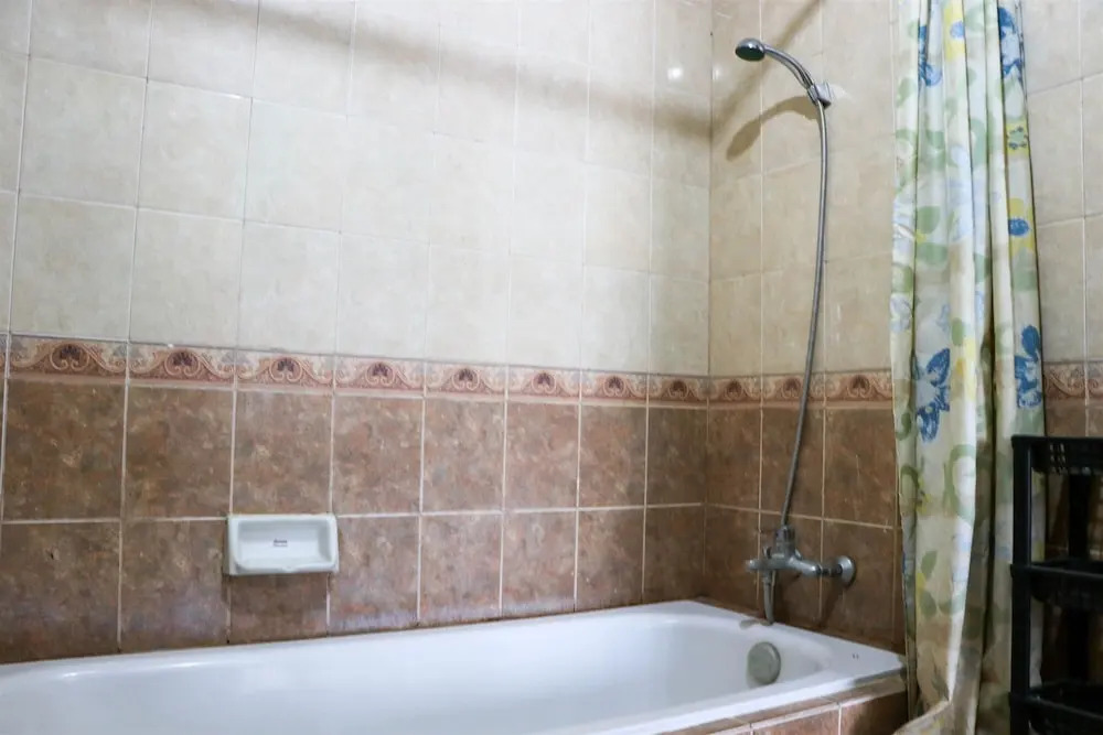 Cozy Living and Modern 2BR Puri Garden Apartment By Travelio