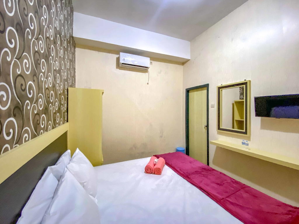 Tinis Guest House Malang Mitra RedDoorz