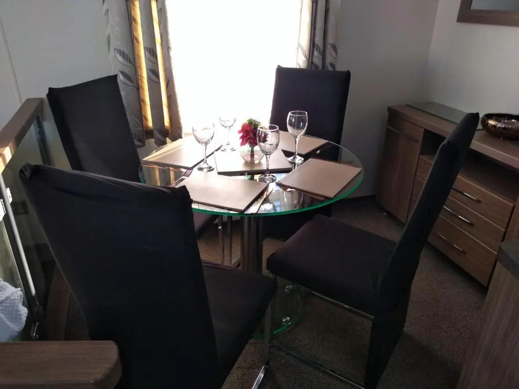 E3 is a 2 Bedroom 6 berth Lodge on Whitehouse Leisure Park in Towyn near Rhyl with Free WiFi, decking and private parking space