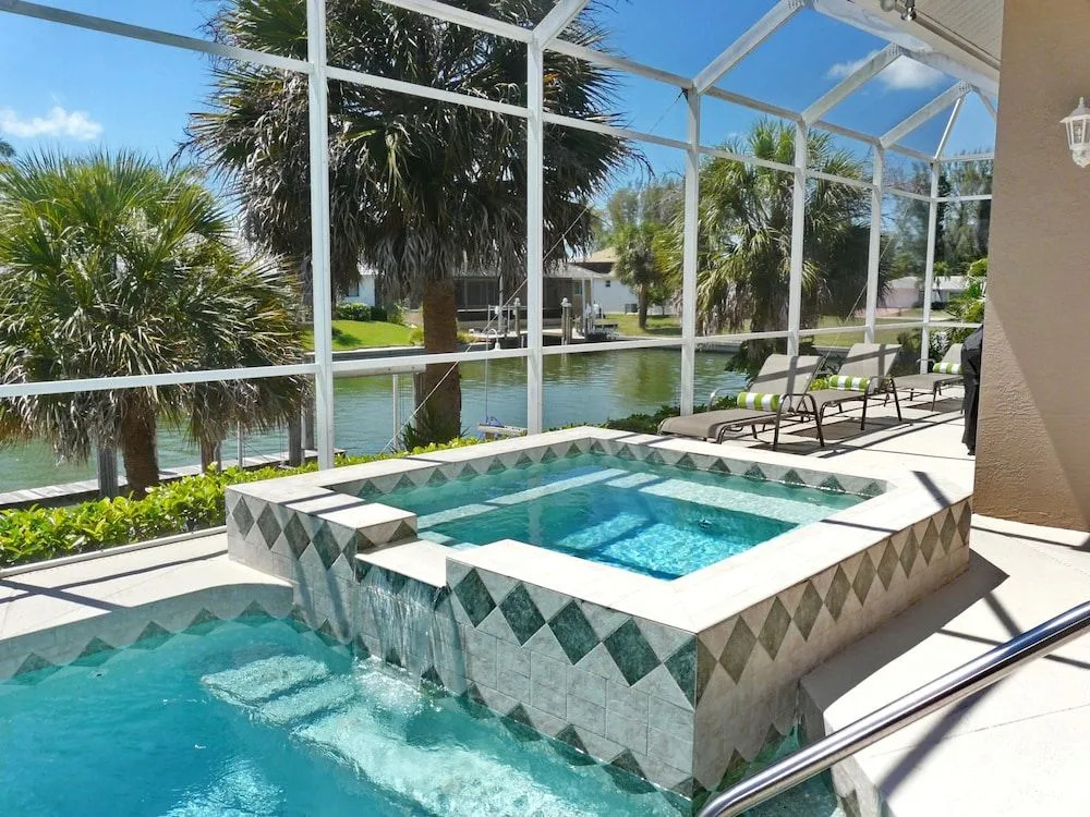 Waterfront home with pool, spa and walk to beach