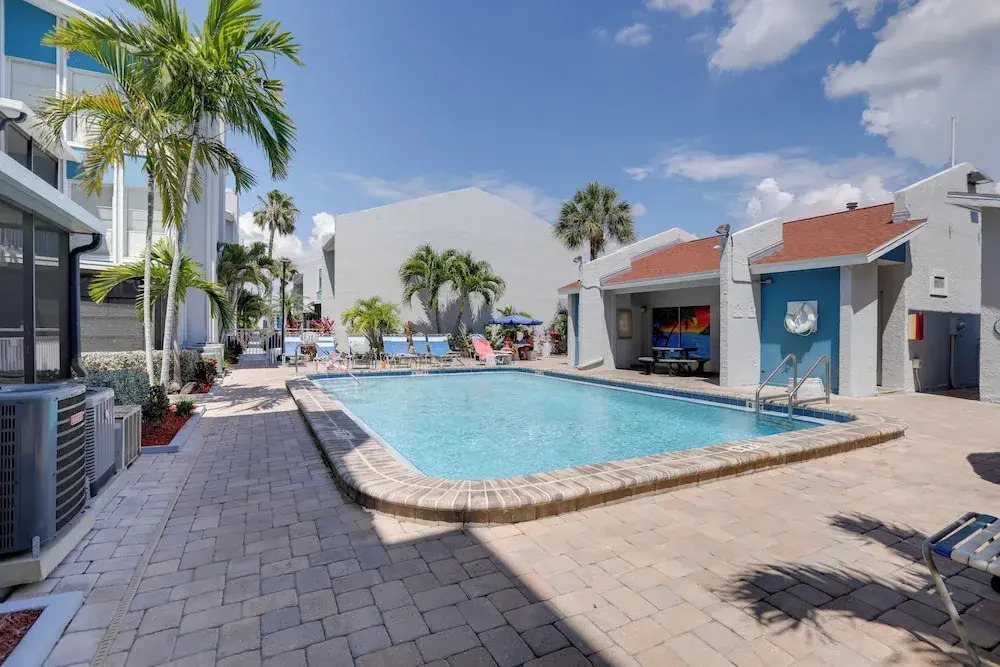Sip, Sunbathe & Relax Poolside: Madeira Beach Gem!