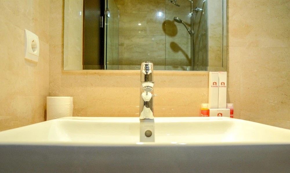 Comfy Studio Room with City View at Menteng Park Apartment By Travelio