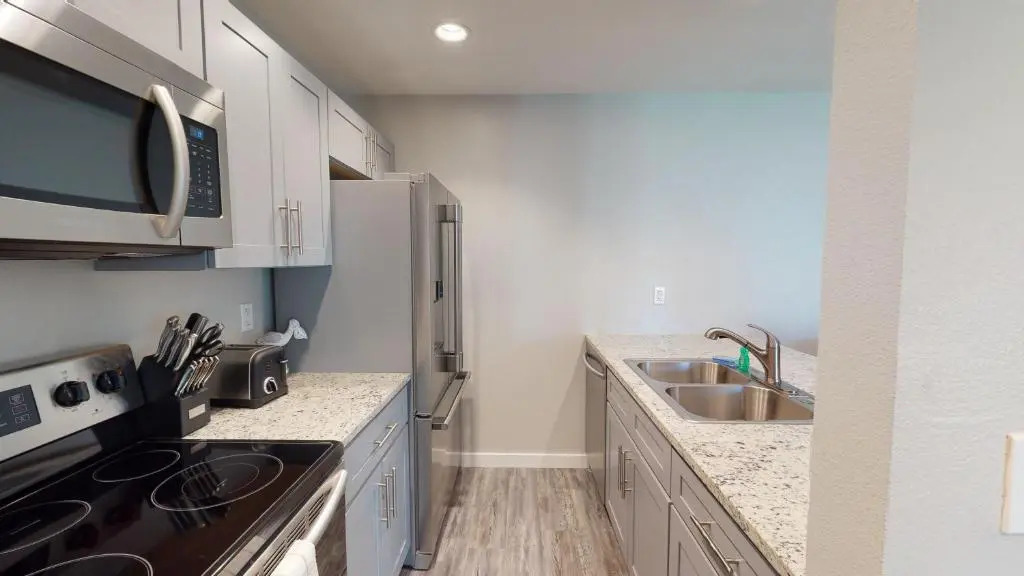 AH-E117 Remodeled First Floor Condo, Across From The Shared Pool & Hot Tub, Near Marina & Ferry