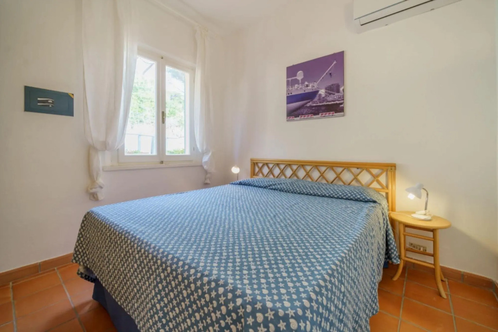 Baia Blu 2 in a small complex of colourful houses that directly overlooks the beach of Forno.-BAIA BLU N°2